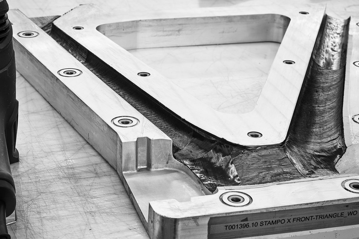 Aluminium mould for a carbon front triangle, with carbon plies laid up